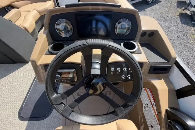 Slide: The Image of Steering console of 2026 Evotti 523CS boat with modern controls and dashboard. - 14