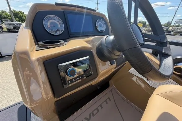 Slide: The Image of Interior dashboard of 2026 Evotti 523CS boat with steering wheel and control panel. - 15