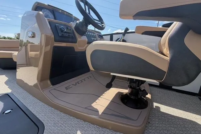 Slide: The Image of 2026 Evotti 523CS boat interior with steering wheel and captain's chair. - 16