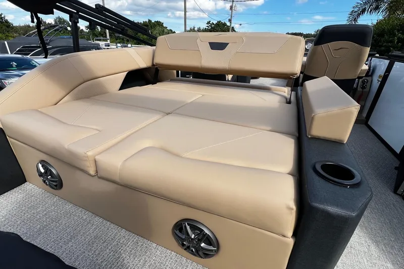 Slide: The Image of Luxurious 2026 Evotti 523CS pontoon boat with beige seating and spacious deck. - 9