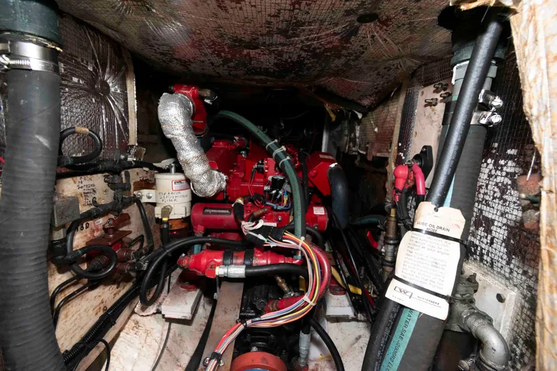 Slide: The Image of Engine compartment of a 1979 Hinckley 43 Sloop, featuring complex wiring and components. - 21