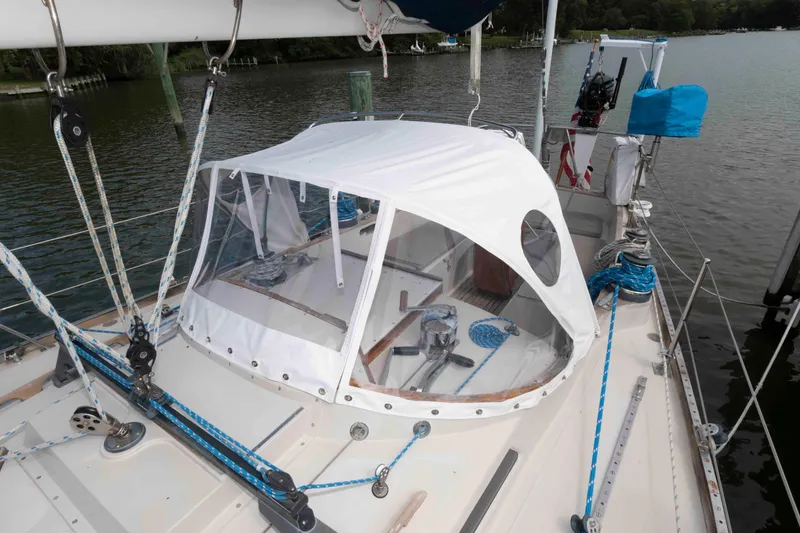 Slide: The Image of Sailing on a 1979 Hinckley 43 Sloop with colorful spinnaker over open water. - 2