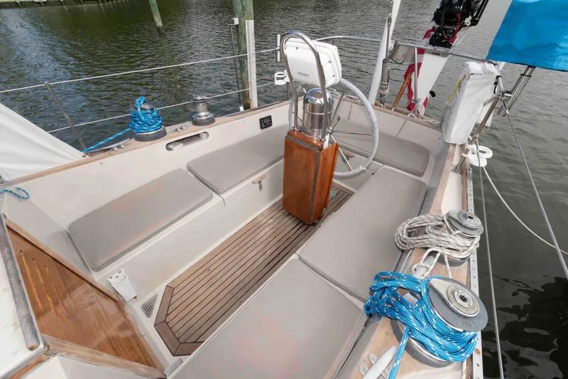 Slide: The Image of 1979 Hinckley 43 Sloop sailing on choppy waters, showcasing deck and rigging. - 4