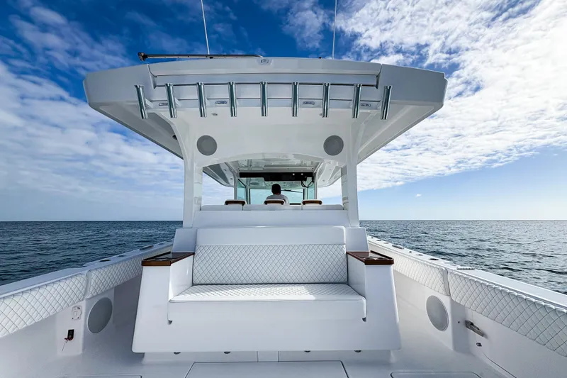 Slide: The Image of 2026 HCB 48 Campeon boat on open sea under blue sky. - 13