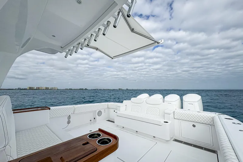 Slide: The Image of 2026 HCB 48 Campeon luxury boat deck with ocean view and retractable canopy. - 17