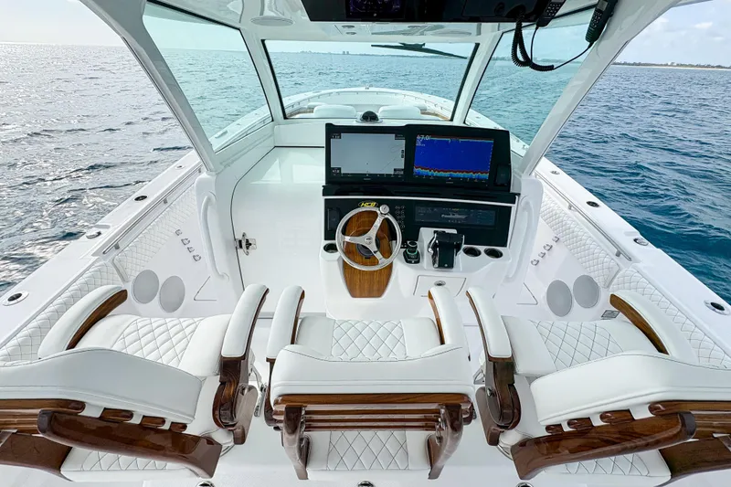 Slide: The Image of Luxurious 2026 HCB 48 Campeon boat interior with advanced navigation system and plush seating. - 19