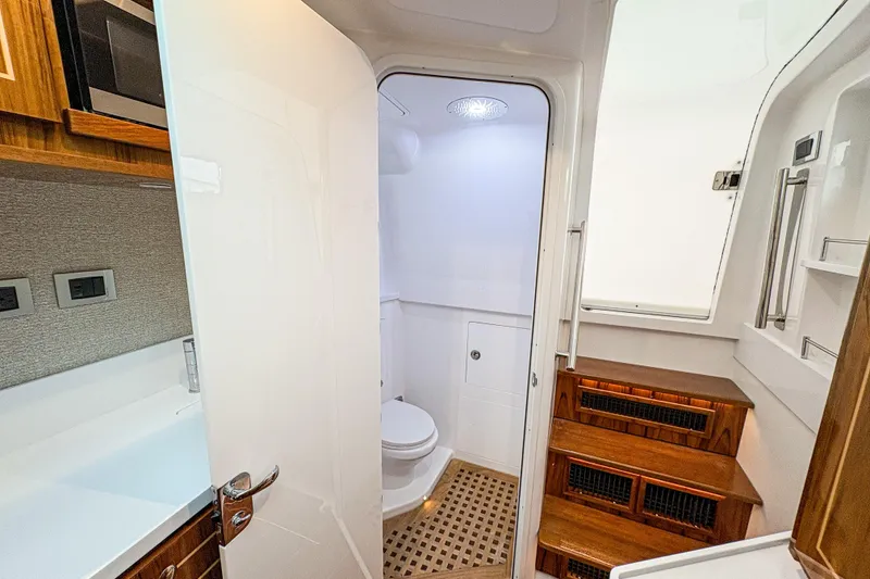 Slide: The Image of Luxurious bathroom interior of 2026 HCB 48 Campeon yacht with wooden accents. - 27