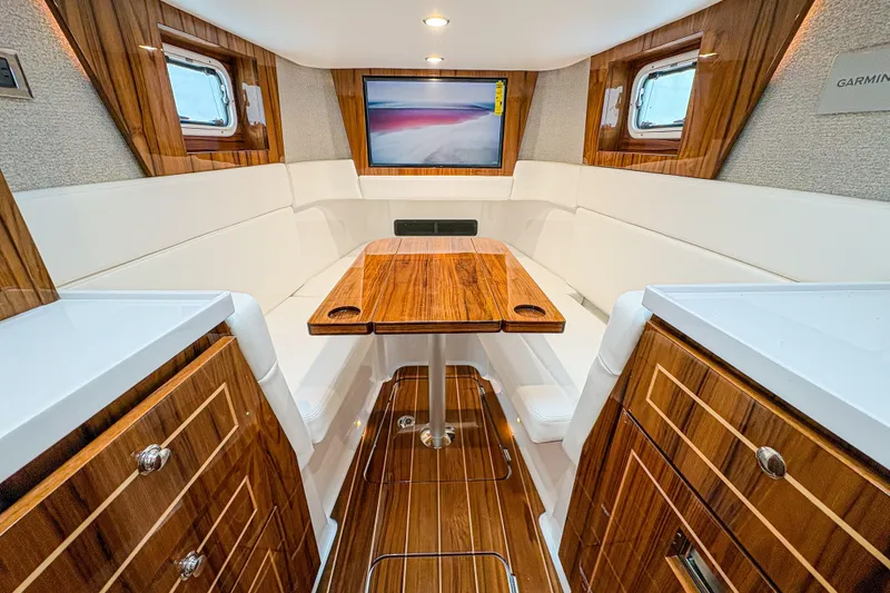Slide: The Image of Luxurious interior of 2026 HCB 48 Campeon yacht with elegant wood finishes and seating. - 30