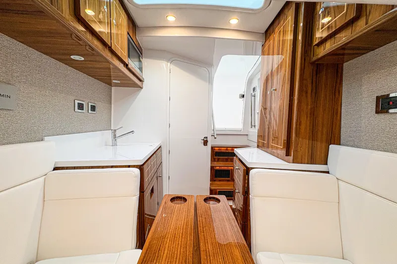 Slide: The Image of Luxurious interior of 2026 HCB 48 Campeon yacht with wood and white leather finishes. - 32