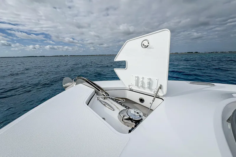 Slide: The Image of 2026 HCB 48 Campeon boat anchor compartment open on calm ocean waters. - 38