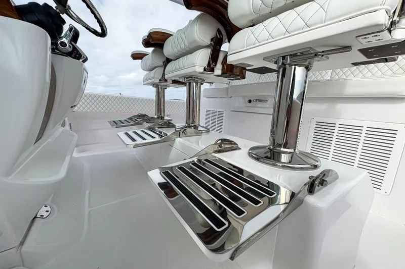 Slide: The Image of Luxurious seating on 2026 HCB 48 Campeon boat with chrome footrests and quilted upholstery. - 43