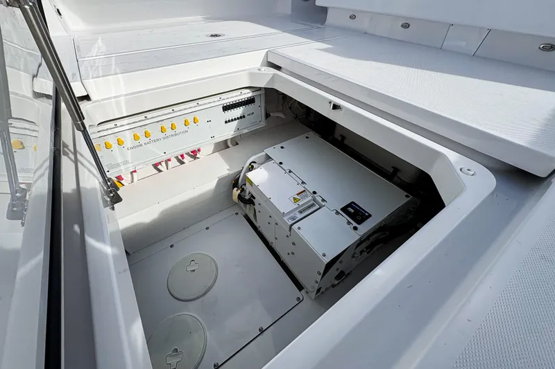 Slide: The Image of 2026 HCB 48 Campeon engine battery distribution system in open compartment. - 44