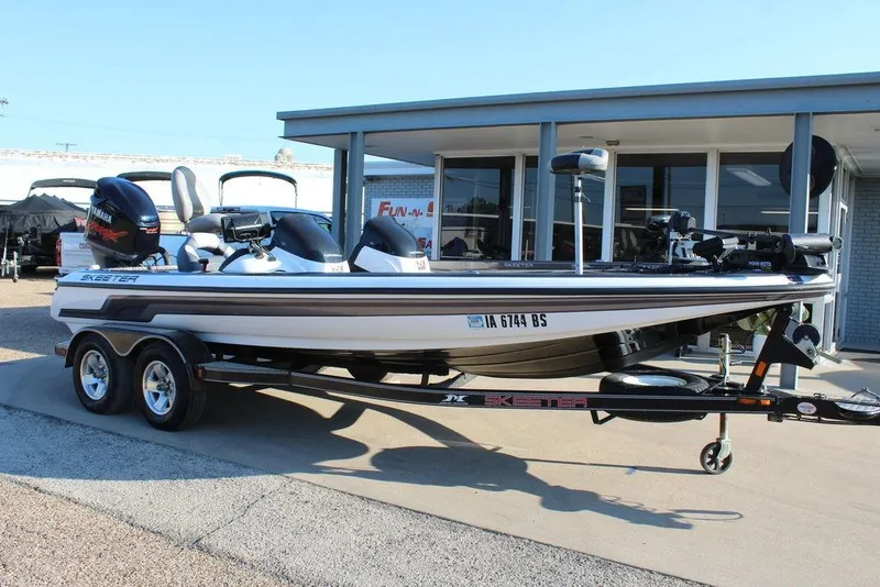 The Image of 2011 Skeeter ZX225 boat on trailer outside dealership. - 1