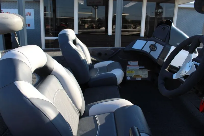 Slide: The Image of 2011 Skeeter ZX225 boat interior with dual seats and steering wheel. - 10