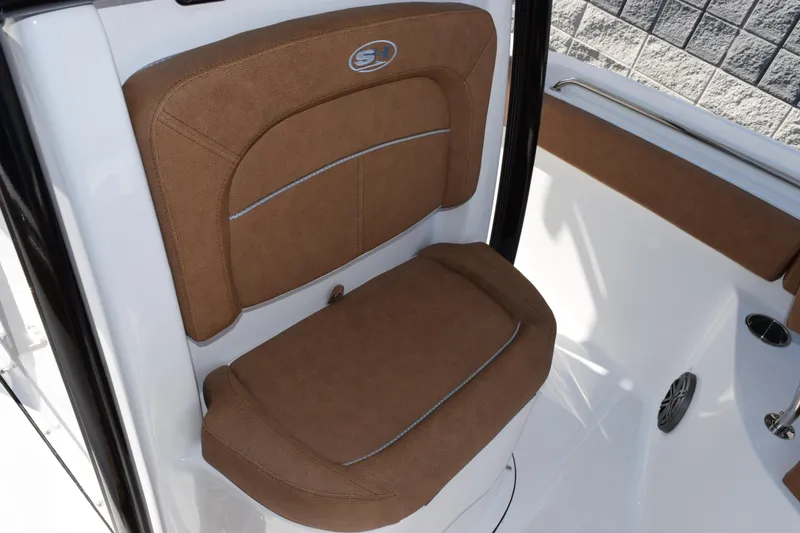 Slide: The Image of Brown cushioned seat on 2026 Sea Hunt Ultra 229 boat, featuring sleek design and comfort. - 13