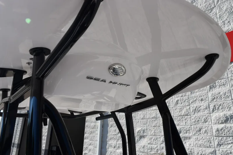 Slide: The Image of 2026 Sea Hunt Ultra 229 boat underside with sleek black supports. - 14