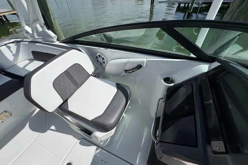 Slide: The Image of 2023 Monterey M-45 boat interior with sleek seating and modern design by the water. - 13