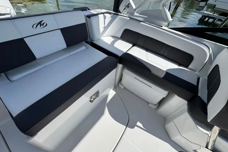 Slide: The Image of 2023 Monterey M-45 boat interior with sleek black and white seating design. - 5