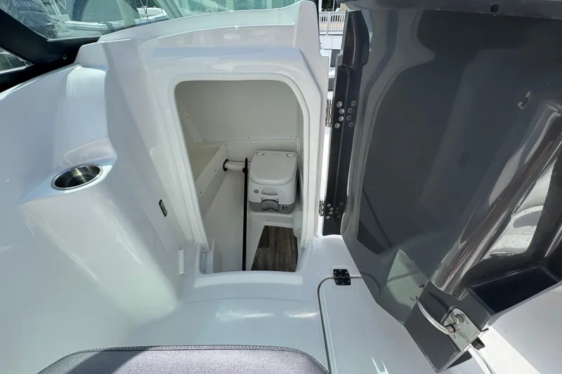 Slide: The Image of 2023 Monterey M-45 boat interior with compact marine toilet and storage area. - 7