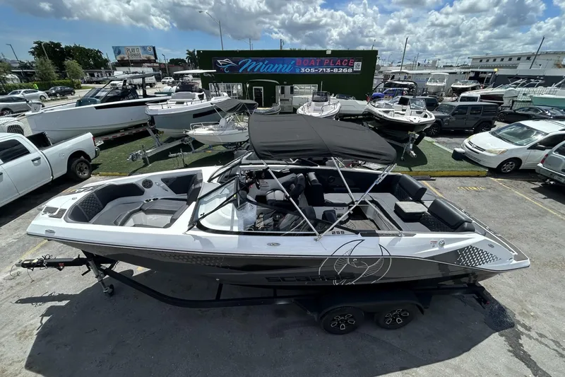 Slide: The Image of 2023 Scarab 255 ID boat with canopy at Miami Boat Place dealership. - 29