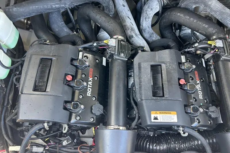 Slide: The Image of Engine compartment of 2023 Scarab 255 ID with dual Rotax 300 engines. - 45