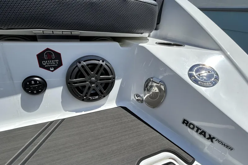 Slide: The Image of 2023 Scarab 255 ID boat interior with JL Audio speaker and Rotax power branding. - 9