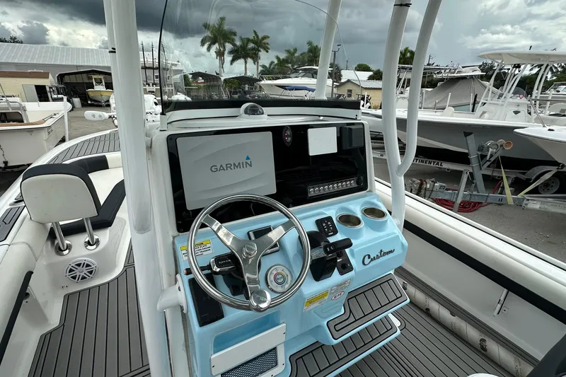 Slide: The Image of 2021 Tidewater 2500 Carolina Bay boat dashboard with Garmin navigation system. - 3