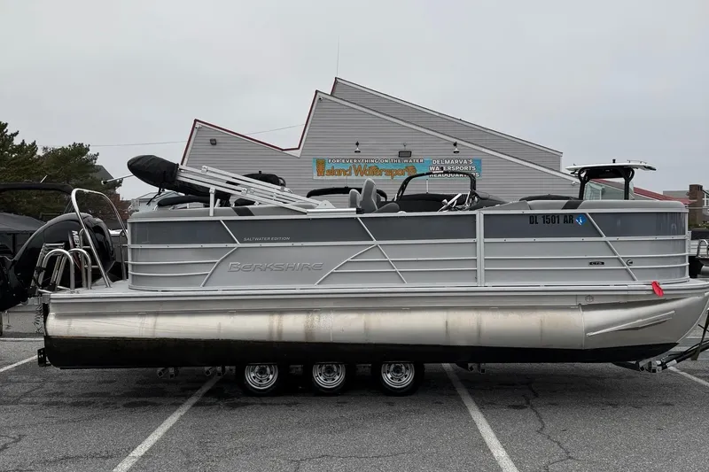 The Image of 2025 Berkshire 22RFX CTS pontoon boat parked in a lot, side view. - 0