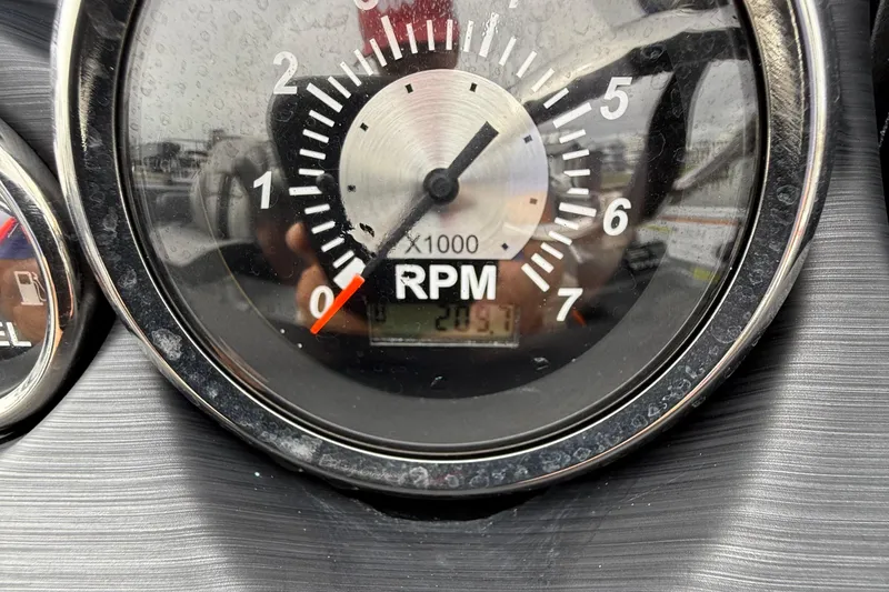 Slide: The Image of Dashboard of 2025 Berkshire 22RFX CTS boat with gauges and Lowrance display. - 10