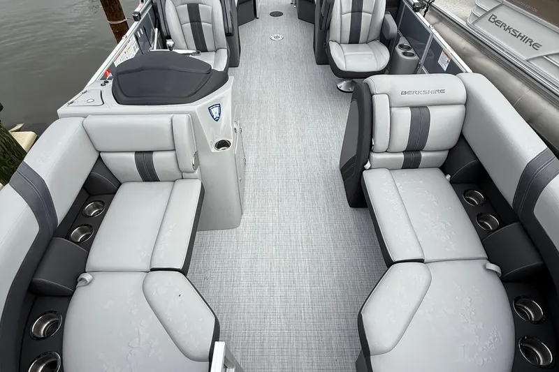 Slide: The Image of 2025 Berkshire 22RFX CTS pontoon boat with Mercury engine, parked outdoors. - 4