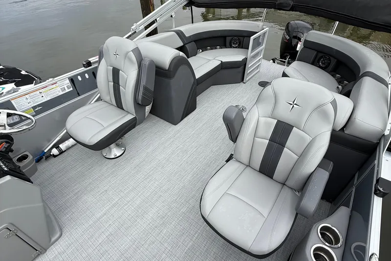 Slide: The Image of 2025 Berkshire 22RFX CTS pontoon boat with outboard motor, parked in a lot. - 5