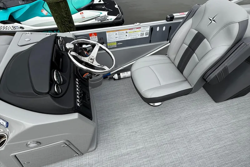 Slide: The Image of 2025 Berkshire 22RFX CTS pontoon boat interior with luxurious gray seating and modern design. - 7
