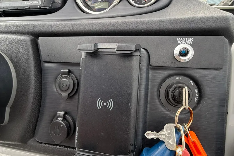 Slide: The Image of 2025 Berkshire 22RFX CTS pontoon boat interior with gray seating and cup holders. - 9