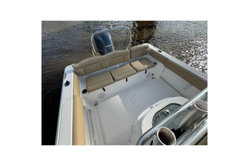 Slide: The Image of 2018 Sea Hunt Ultra 234 boat interior with cushioned seating and Yamaha 200 outboard motor. - 21