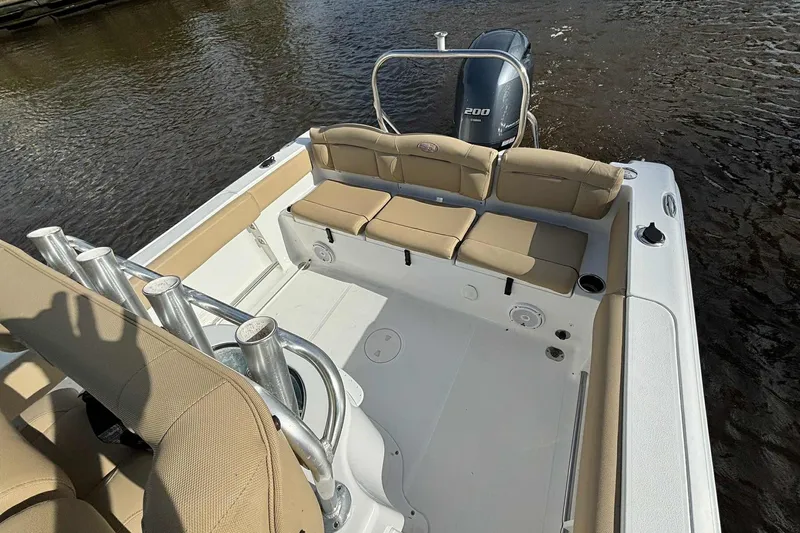Slide: The Image of 2018 Sea Hunt Ultra 234 boat interior with seating and Yamaha 200 engine. - 22