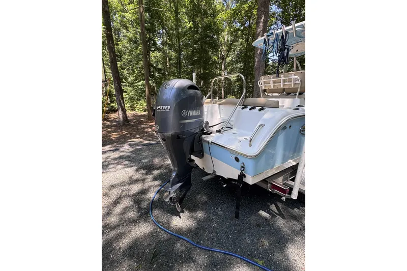 Slide: The Image of 2018 Sea Hunt Ultra 234 boat with Yamaha engine on calm water. - 3