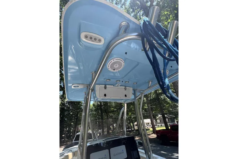 Slide: The Image of 2018 Sea Hunt Ultra 234 boat with Yamaha engine on a calm river. - 5