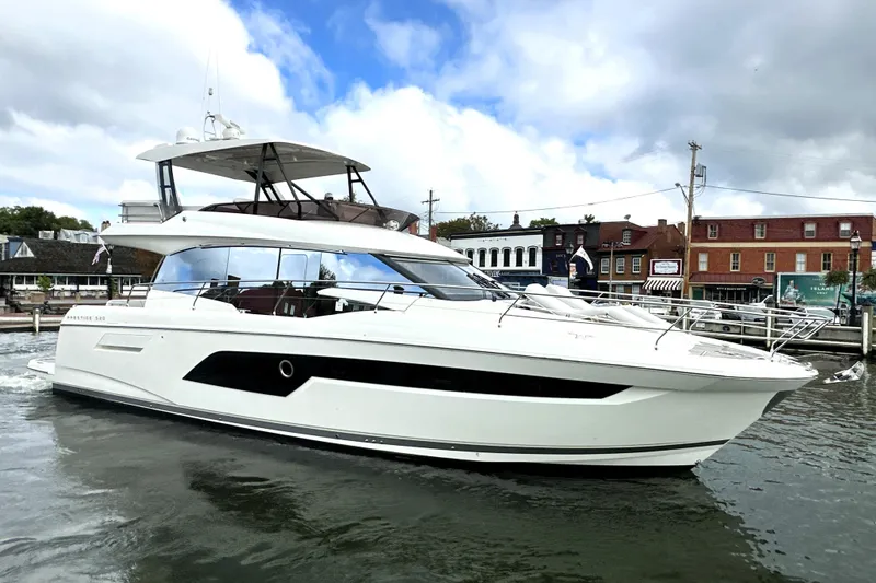 The Image of 2023 Prestige 520 yacht docked in a marina, showcasing sleek design and modern features. - 0