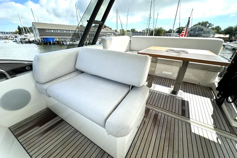 Slide: The Image of Luxurious seating area on 2023 Prestige 520 yacht, featuring elegant design and waterfront view. - 22