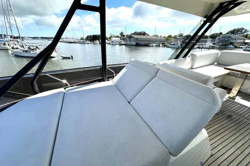Slide: The Image of Luxurious 2023 Prestige 520 yacht with spacious deck and marina view. - 25