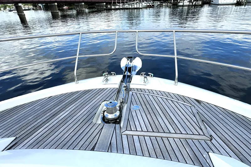 Slide: The Image of Bow of 2023 Prestige 520 yacht with sleek deck and water view. - 34