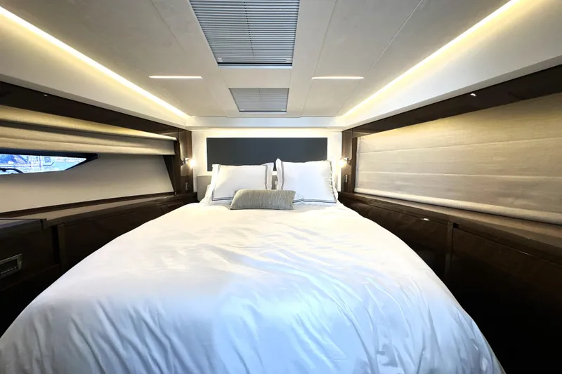 Slide: The Image of Luxurious bedroom interior of 2023 Prestige 520 yacht with elegant lighting and modern design. - 4