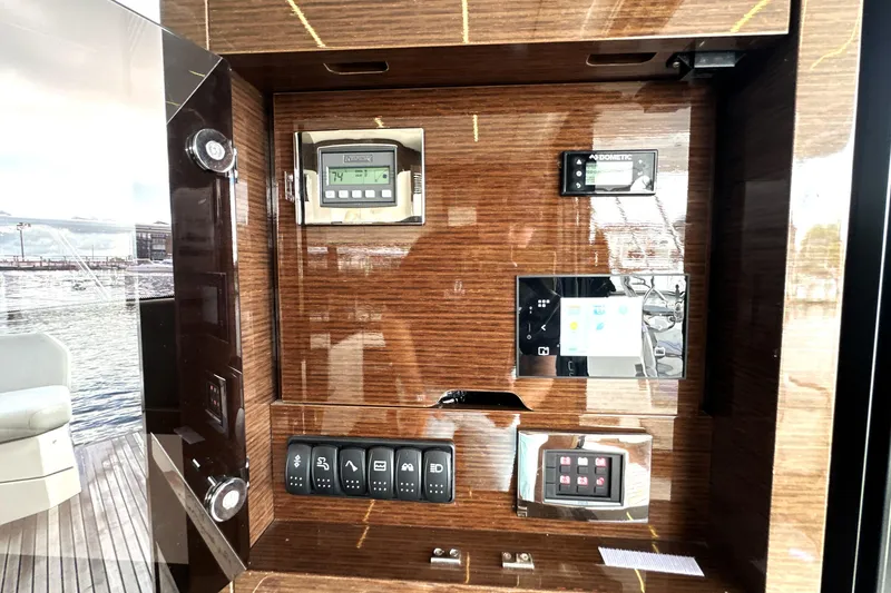 Slide: The Image of Control panel of 2023 Prestige 520 yacht with digital displays and switches. - 40