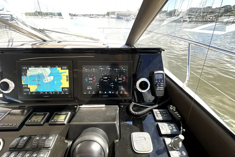 Slide: The Image of Helm of 2023 Prestige 520 yacht with navigation and control systems. - 54