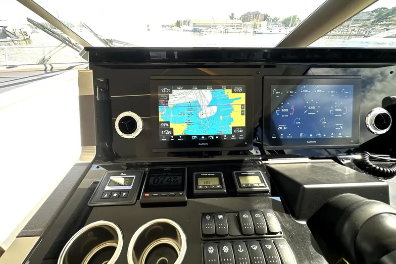 Slide: The Image of Control panel of 2023 Prestige 520 yacht with navigation and monitoring screens. - 55