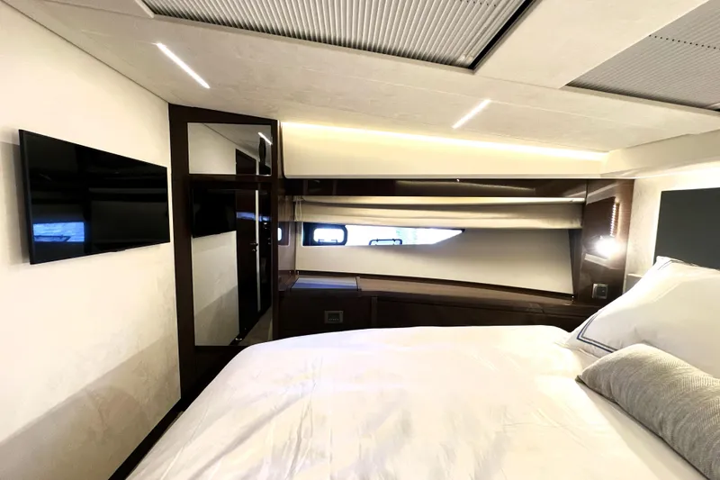 Slide: The Image of Luxurious interior of 2023 Prestige 520 yacht bedroom with modern design and amenities. - 59