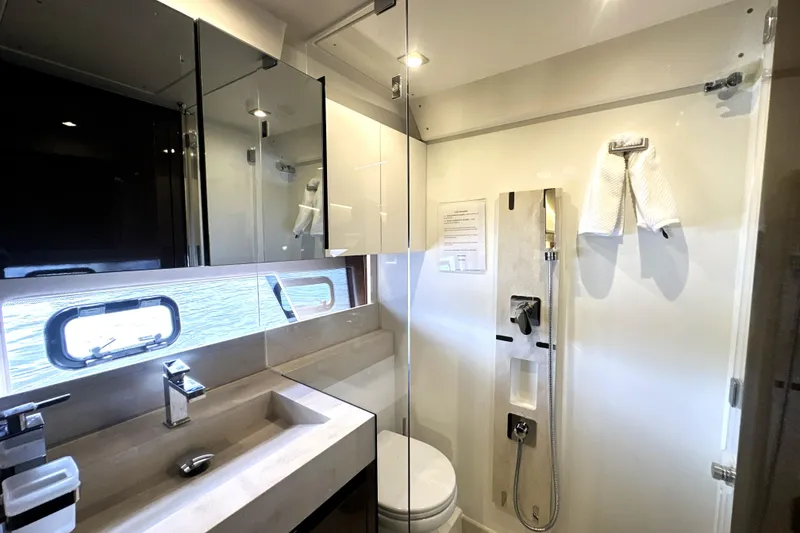 Slide: The Image of Modern bathroom in 2023 Prestige 520 yacht with sleek fixtures and ocean view. - 61