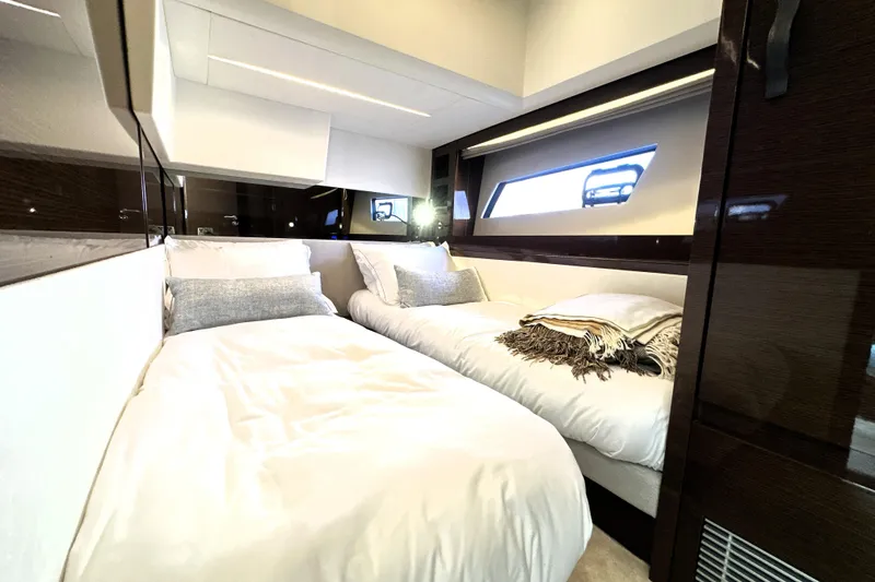 Slide: The Image of Luxurious twin cabin interior of 2023 Prestige 520 yacht, featuring modern design and comfort. - 63