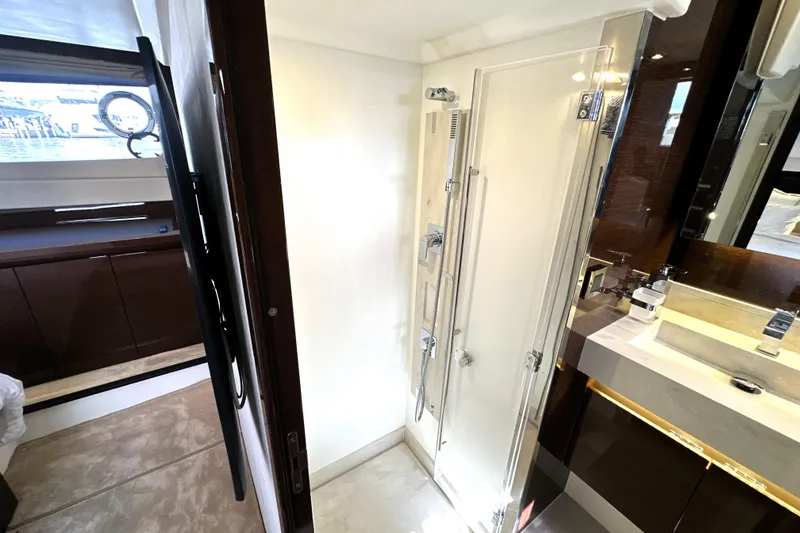 Slide: The Image of Luxurious bathroom interior of 2023 Prestige 520 yacht with modern shower and vanity. - 74