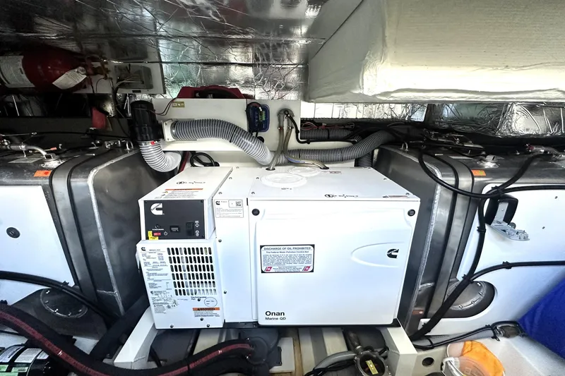 Slide: The Image of Engine room of 2023 Prestige 520 yacht with Onan generator and equipment. - 79